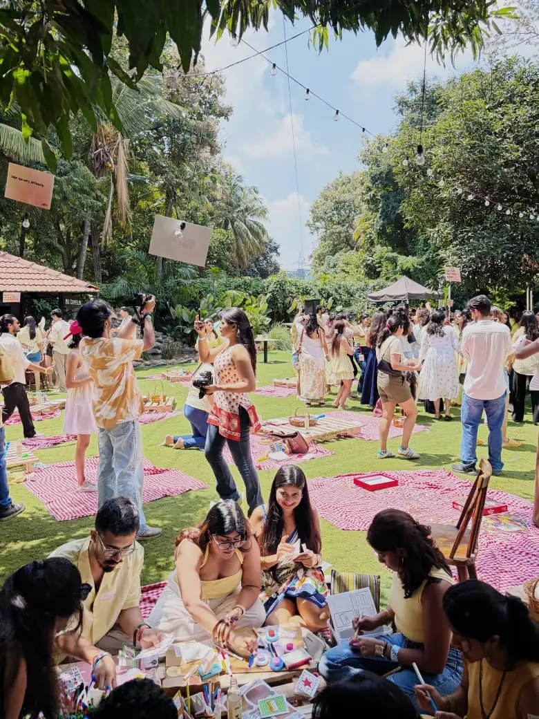 Over 200 people in yellow at the Picnic Rave by Kaunversations on Offlyn in Bengaluru