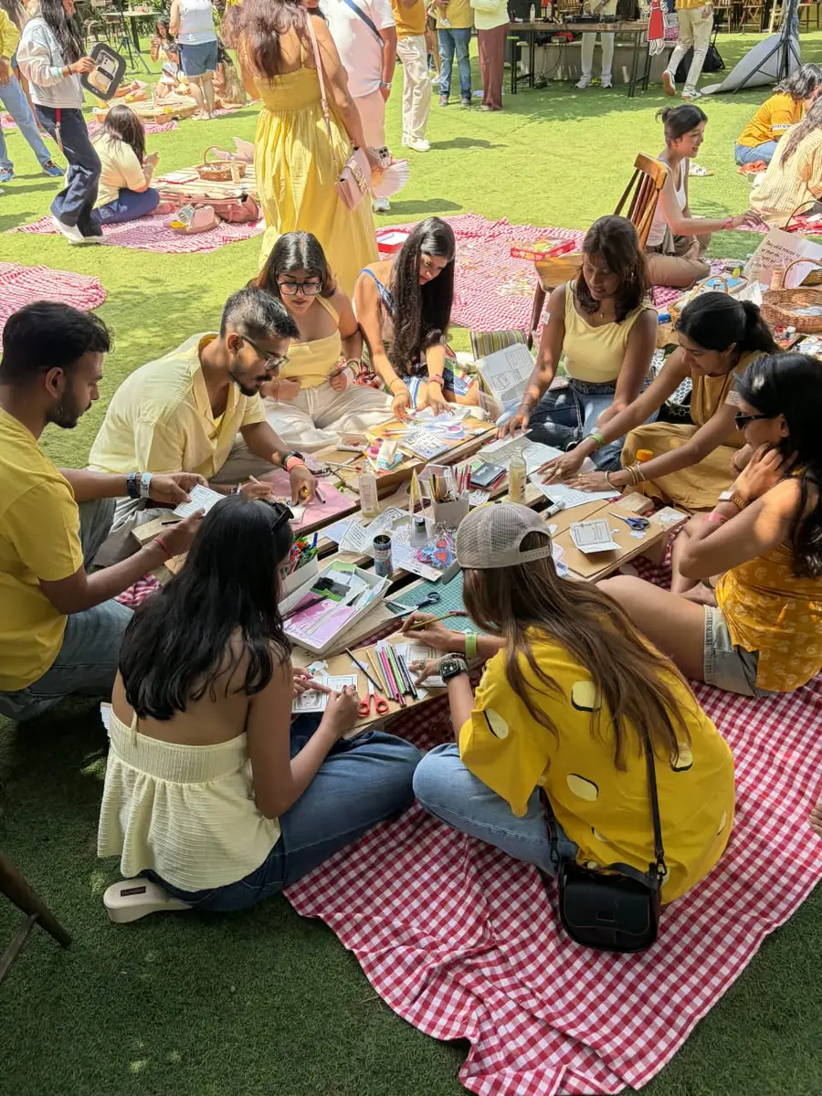 Guests painting on picnic blankets at Picnic Rave Bengaluru 2026
